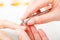 Preparing nails before manicure, cutting cuticles