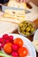 Preparing olives and emmenthal cheese