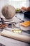 Preparing pie with pumpkins on wooden table