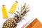 Preparing pineapple juice. Cut pineapple with a knife on white background top view