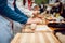 Preparing pizza. Cooks hands and table close-up.