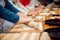 Preparing pizza. Cooks hands and table close-up.