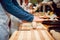 Preparing pizza. Cooks hands and table close-up.