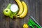 Preparing quick lunch for schoolchild. Fruits on dark wooden table background top view copyspace