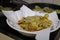 Preparing sliced potatoes in a bowl