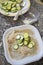 Preparing sliced zucchini au gratin