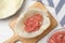 Preparing stuffed cabbage roll on white wooden table, flat lay