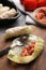 Preparing stuffed cabbage rolls on grey table, closeup