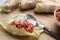 Preparing stuffed cabbage rolls on wooden board, closeup