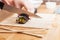 Preparing sushi, cutting. Salmon, avocado, rice and chopsticks on wooden table.