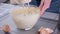 Preparing sweet food dessert in kitchen at home - mixing ingredients in bowl cooking dough