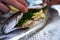 Preparing trouts with lemons, butter and fresh dill.