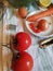 Preparing vegetables on the desk for vegetarian soup without meat cabbage, tomato, onion, carrot, cherry, lemon, pepper, olive oil