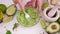 Preparing vegetarian avocado sauce - Mashing avocado in bowl with a fork