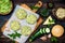 Preparing veggies cutlets or patties for burgers. Zucchini quinoa veggie burger with pesto sauce and sprouts. Top view, overhead