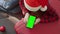 Preparing for the winter holidays with a smartphone in your hands. Planning a New Year\'s vacation and a winter trip