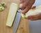 Preparing zuchini hands on the kitchen table close up