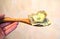 Prepayment service gratitude concept. Salary. American bills, dollars in a wooden spoon