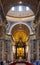 Presbytery and apse with St. Peter`s Cathedra Petri in St. Peter`s Basilica of Vatican City in Rome in Italy