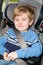 Preschool age boy in a booster seat