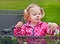 Preschool Aged Girl Playing with Toy Horses