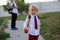Preschool blond child, cute boy in uniform, going in preschool for the first time after summer