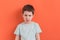 Preschool boy on an orange background