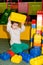 A preschool boy plays with large blocks of construction set in the playroom, a children's entertainment center, an
