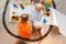 Preschool boys drawing on floor on paper, playing with educational toys - blocks, train, railroad, vehicles at home or daycare.