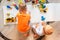 Preschool boys drawing on floor on paper, playing with educational toys - blocks, train, railroad, vehicles at home or daycare.