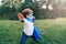 Preschool Caucasian child boy playing superhero in green costume