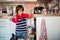 Preschool child, boy, helping mom, putting dirty dishes in dishwasher