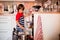 Preschool child, boy, helping mom, putting dirty dishes in dishwasher