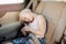 Preschool girl child sitting in car seat . Sleeping kid in automobile