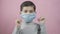 Preschool kid boy wearing a medical face mask