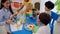 Preschool teacher with children study in classroom. Kindergarten back to school a