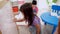 Preschool teacher with children study in classroom. Kindergarten back to school a