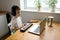 Preschooler boy in headphones learns to play the musical keyboard online. Distance learning to play the piano. Online music