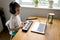 Preschooler boy in headphones learns to play the musical keyboard online. Distance learning to play the piano. Online music
