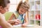 Preschooler Child Reading with Mother In Nursery