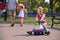 Preschooler driving his toy vehicle