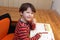 Preschooler genius boy solving math exercise