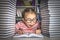 Preschooler little girl reading a book in the library - Pupil loves lecture, preparing for school.