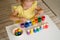 A preschooler plays a new sorter toy that helps a child learn colors