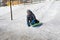 Preschooler sled ride