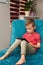 Preschooler watches tablet at home on the couch