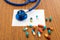 Prescription with colorful pills and stethoscope