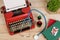 Prescription medicine or medical diagnosis - doctor workplace with stethoscope, pills, typewriter with blank paper on wooden table