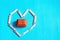 Present box inside heart shaped wooden pins
