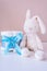 Present cake with diapers for newborn baby boy with plush rabbit